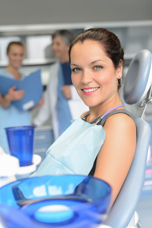 woman-patient-sitting-chair-dental-surgery-professional-dentist-team-checkup_skfhruaej